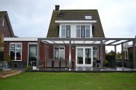 Zwartsluis, vrijstaande woning voorzien van Sigma S2U primer en Sigma S2U Gloss. Pergola met Sigmalife VS Acryl satin.